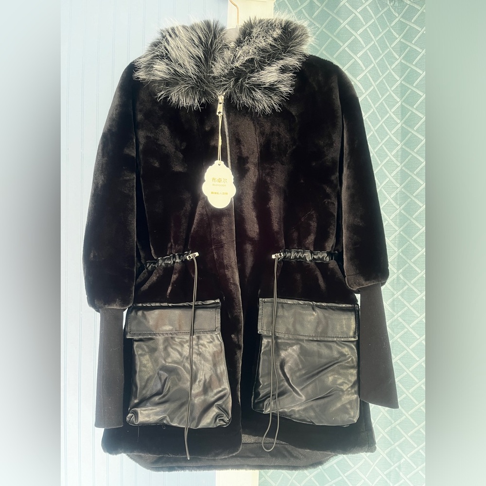 Faux fur winter jacket  with waist tight and fox fur hat.